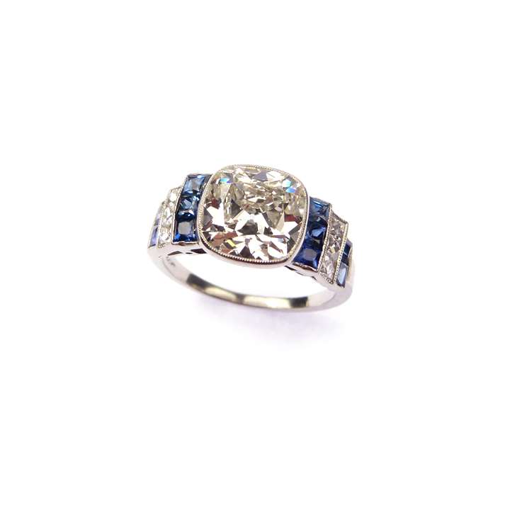Cushion cut diamond, sapphire and diamond ring